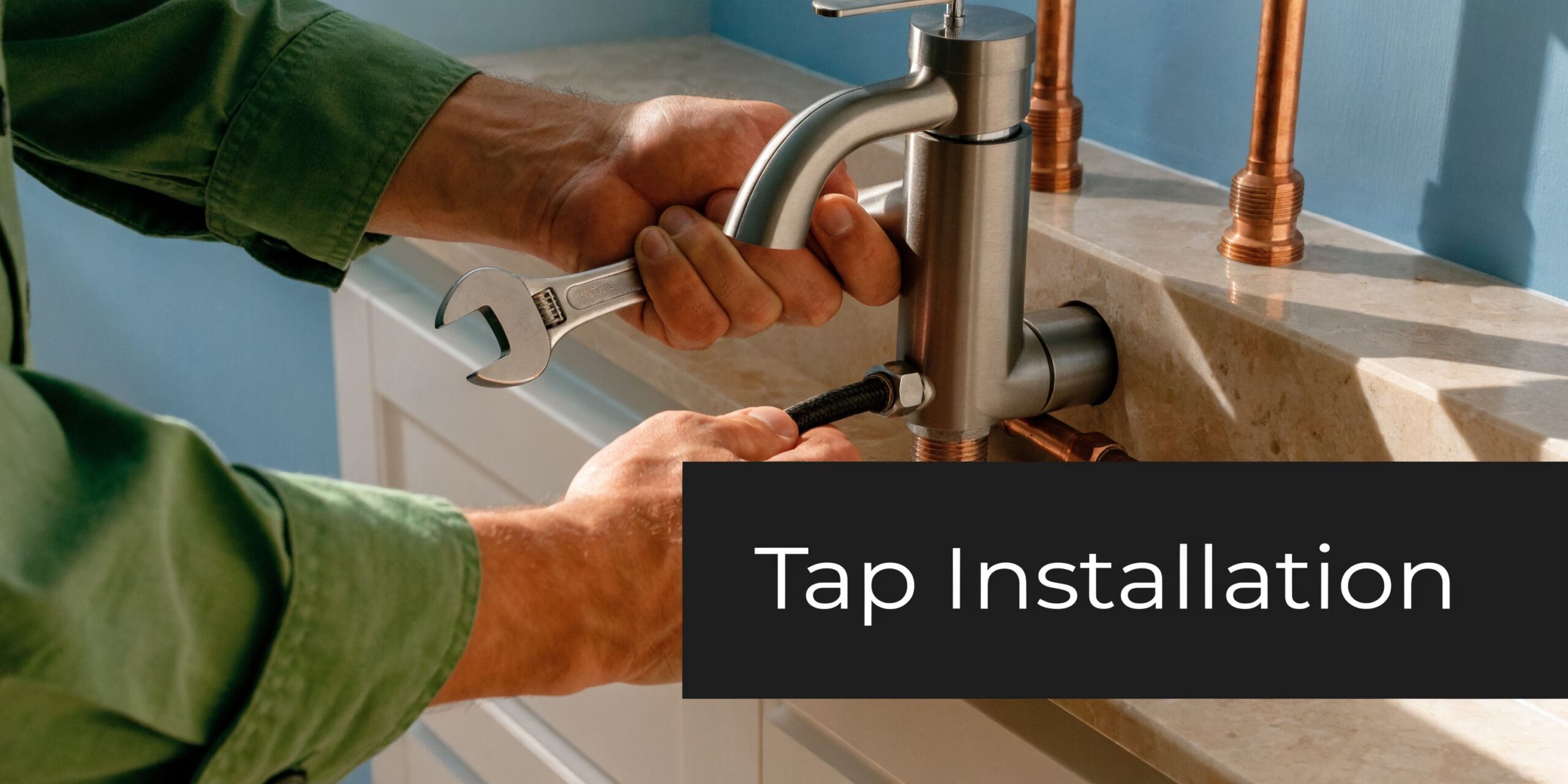 A professional plumber installing a new modern metallic kitchen tap on a marble countertop with tools.