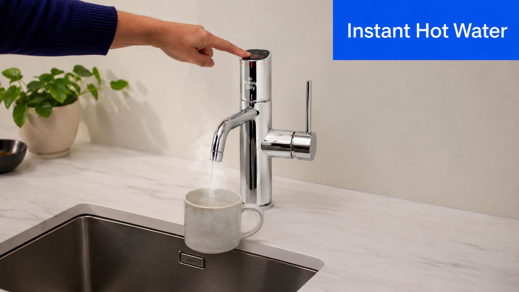 A hand touches the digital control on a Boiling Billy instant hot water tap over a mug.