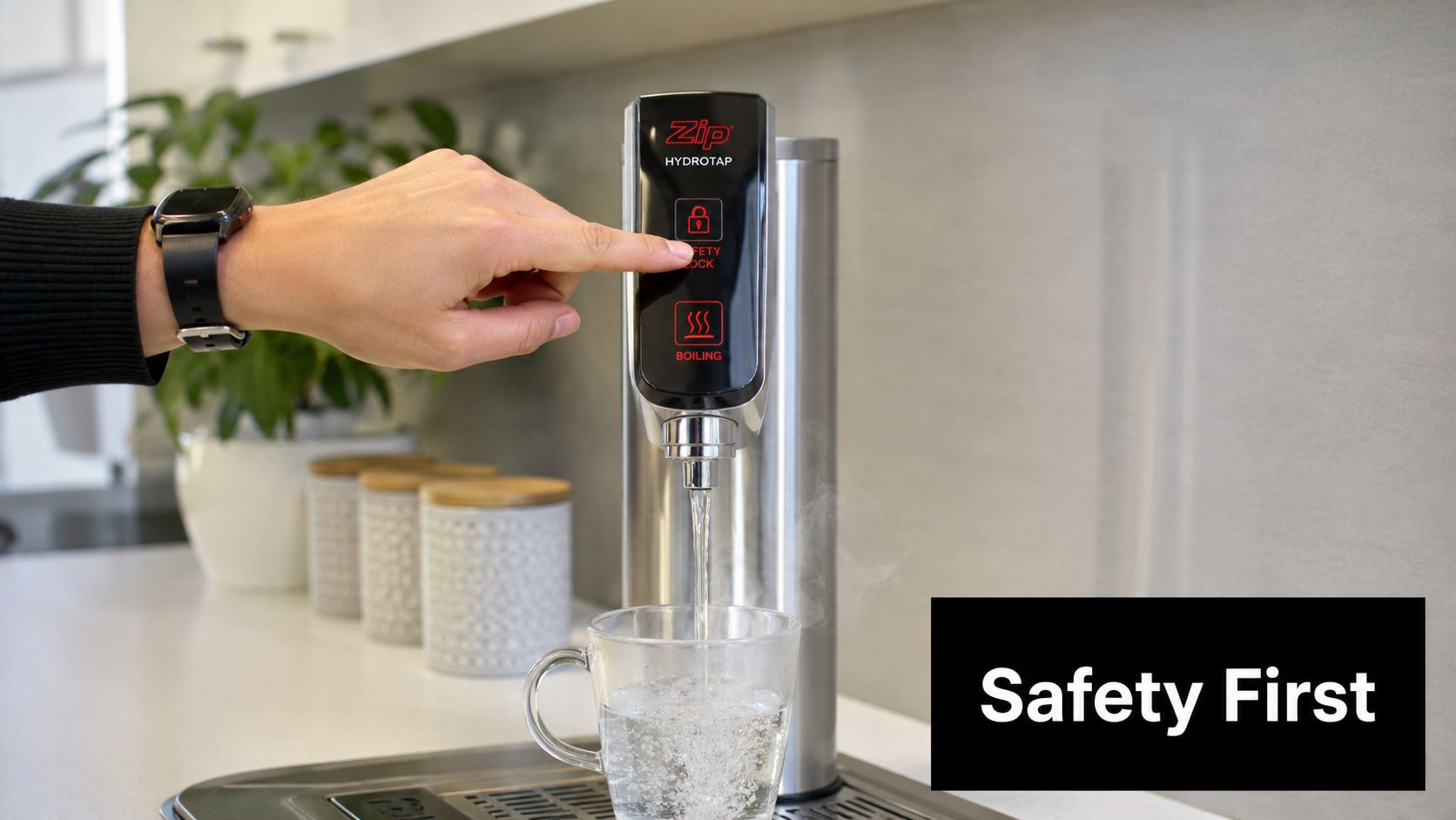 A hand pressing the safety lock button on a Zip HydroTap boiling water dispenser in a modern kitchen.