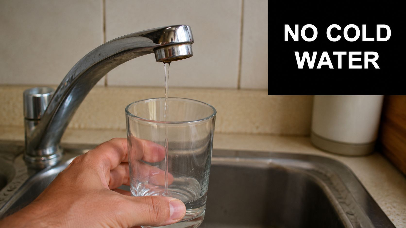 A person holding a clear glass under a kitchen faucet with running water to represent plumbing issues.